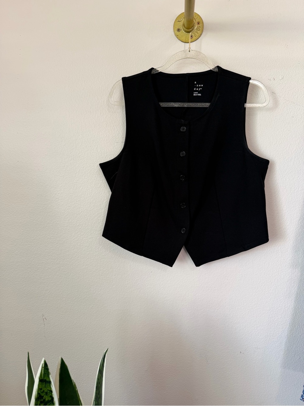 A New Day black vest